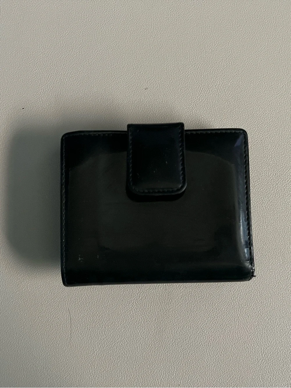 Gucci Black Patent Leather Bi-Fold Wallet with Embossed G